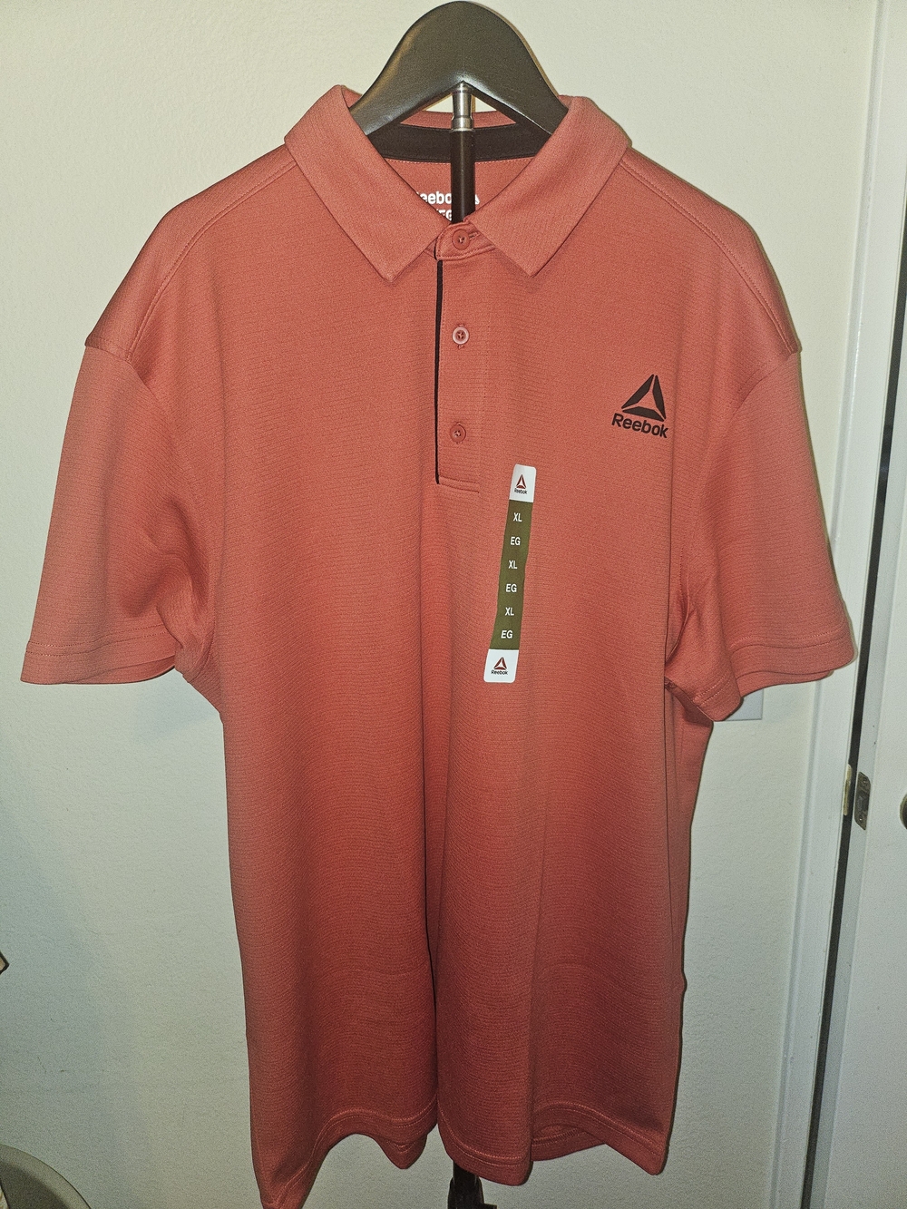 Reebok Men’s Polo Shirt in Coral Red with Black Logo